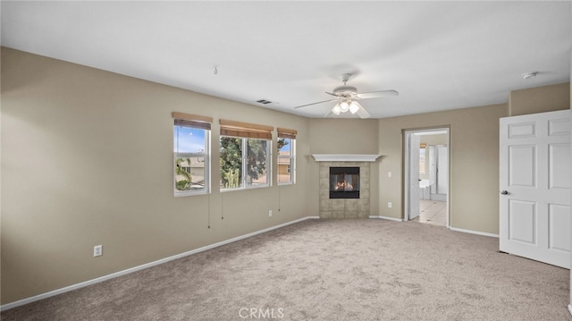 3360 Hammock St, Perris, CA 92571 - unfurnished living room featuring ceiling fan, carpet flooring, and a tile fireplace