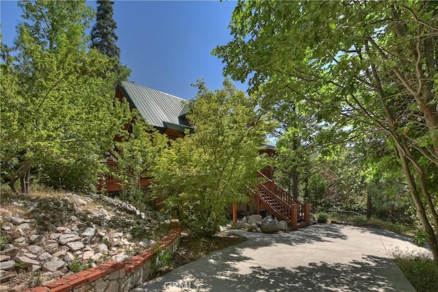 29729 Katherine Way, Cedar Glen, CA 92321 - view of home's exterior featuring stairway and a metal roof