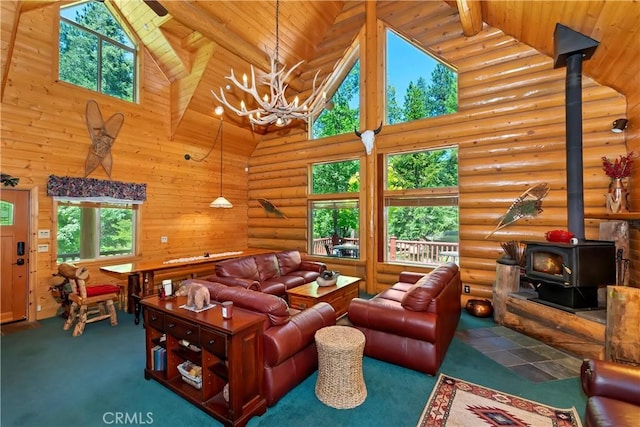 29729 Katherine Way, Cedar Glen, CA 92321 - living room with high vaulted ceiling, a wood stove, a wooden ceiling with exposed beams, a chandelier, and log walls