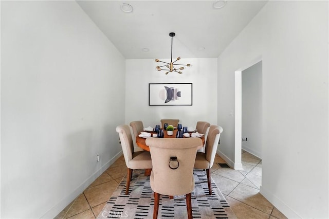 236 N Michigan Ave, Pasadena, CA 91106 - dining area featuring a chandelier, light tile patterned flooring, and lofted ceiling