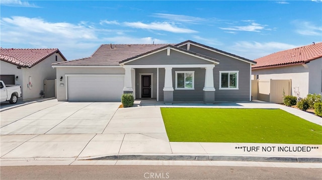 10305 Yukon River Ave, Bakersfield, CA 93311 - craftsman inspired home featuring a garage, driveway, a porch, a tiled roof, and stucco siding