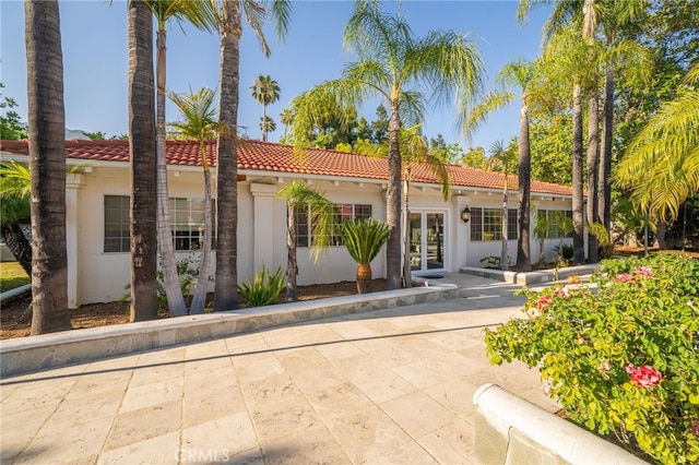 275 E 24th St, Upland, CA 91784 - back of property with french doors, stucco siding, and a tile roof