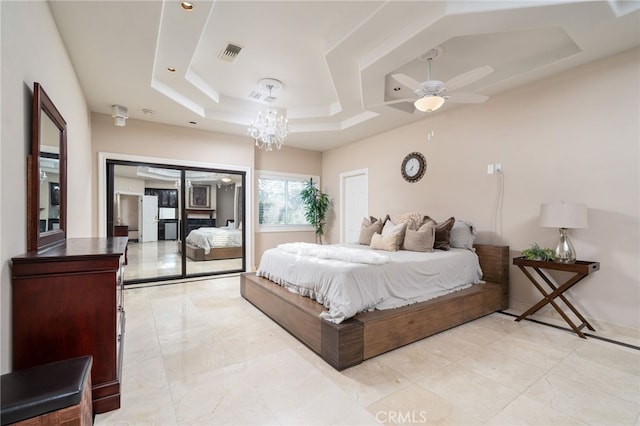 275 E 24th St, Upland, CA 91784 - bedroom featuring a tray ceiling and a chandelier