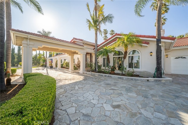 275 E 24th St, Upland, CA 91784 - mediterranean / spanish home featuring a tiled roof and stucco siding