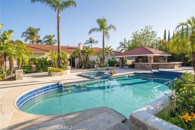 275 E 24th St, Upland, CA 91784 - view of pool featuring a gazebo, a pool with connected hot tub, a patio, and exterior bar