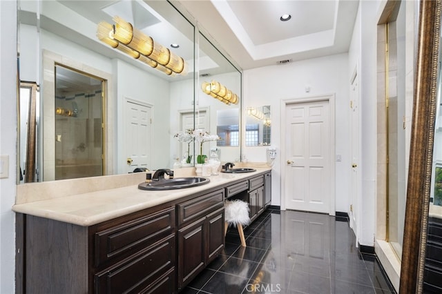 275 E 24th St, Upland, CA 91784 - bathroom with double vanity, a stall shower, a raised ceiling, and recessed lighting