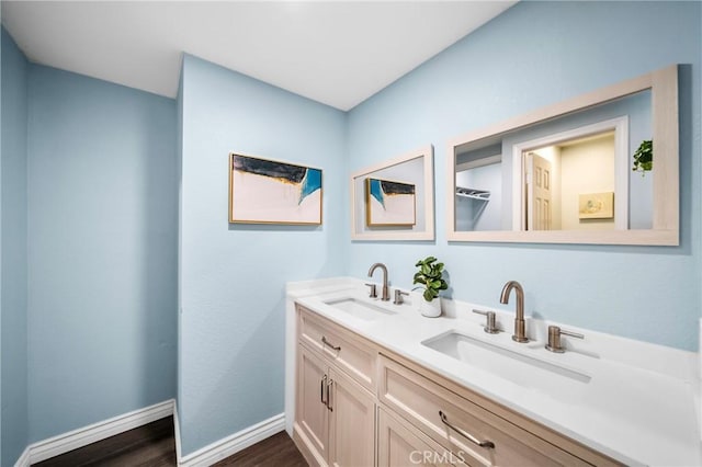 120 Poxon Pl, West Covina, CA 91790 - bathroom featuring double vanity and wood finished floors