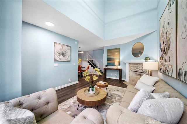 120 Poxon Pl, West Covina, CA 91790 - living area featuring stairs, wood finished floors, and a fireplace