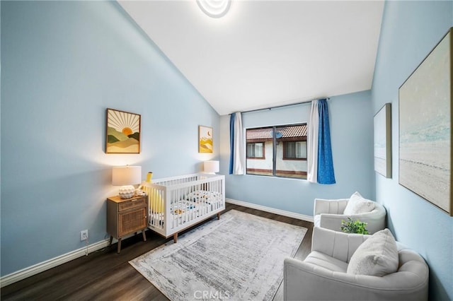 120 Poxon Pl, West Covina, CA 91790 - bedroom with lofted ceiling, dark wood-type flooring, and a crib