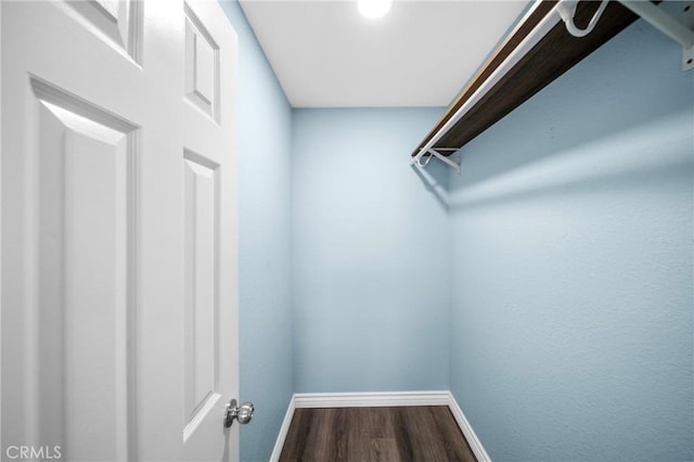 120 Poxon Pl, West Covina, CA 91790 - spacious closet with dark wood-type flooring