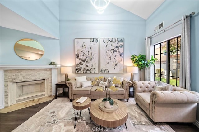 120 Poxon Pl, West Covina, CA 91790 - living area featuring high vaulted ceiling, wood finished floors, and a fireplace