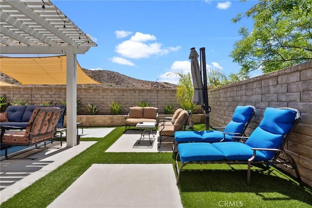 28518 High Ridge Dr, Saugus, CA 91390 - fenced backyard featuring an outdoor living space, a patio area, a pergola, and a mountain view