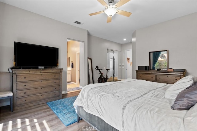 28518 High Ridge Dr, Saugus, CA 91390 - bedroom featuring wood finished floors, connected bathroom, recessed lighting, a ceiling fan, and a closet