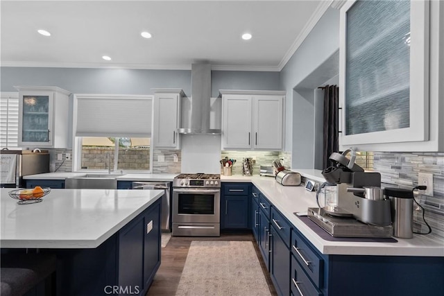 28518 High Ridge Dr, Saugus, CA 91390 - kitchen featuring stainless steel appliances, blue cabinetry, wall chimney range hood, light countertops, and white cabinets
