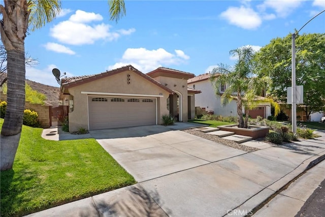 28518 High Ridge Dr, Saugus, CA 91390 - mediterranean / spanish home featuring stucco siding, concrete driveway, an attached garage, and a tile roof