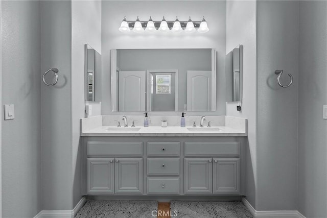 28518 High Ridge Dr, Saugus, CA 91390 - bathroom featuring double vanity and baseboards