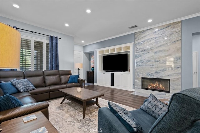 28518 High Ridge Dr, Saugus, CA 91390 - living area featuring crown molding, wood finished floors, recessed lighting, and a premium fireplace