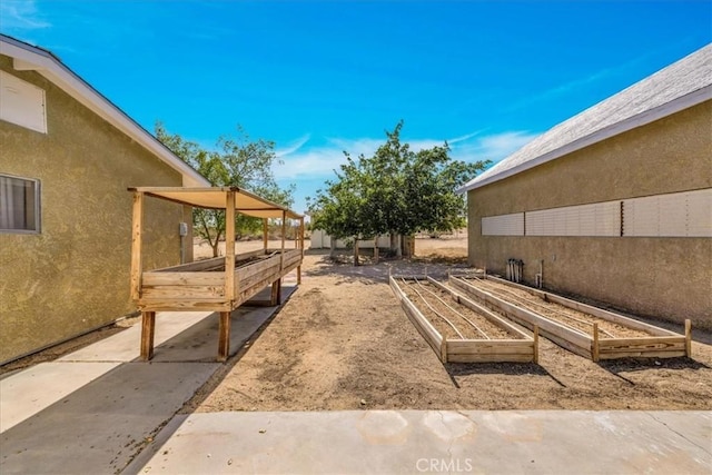 1638 Hales Dr Unit 29, Palms, CA 92277 - view of yard with a vegetable garden