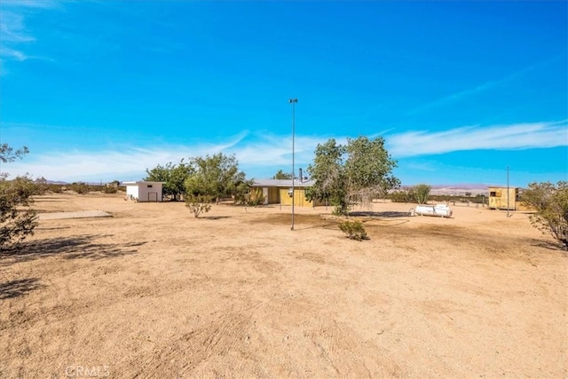 1638 Hales Dr Unit 29, Palms, CA 92277 - view of yard featuring a shed and a view of rural / pastoral area