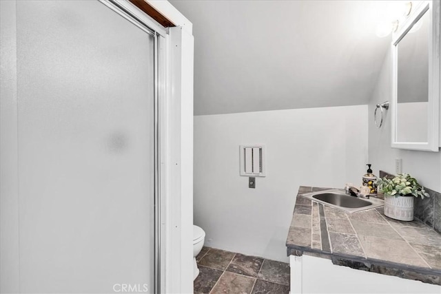 1638 Hales Dr Unit 29, Palms, CA 92277 - full bathroom with vanity, a stall shower, stone finish floors, and vaulted ceiling