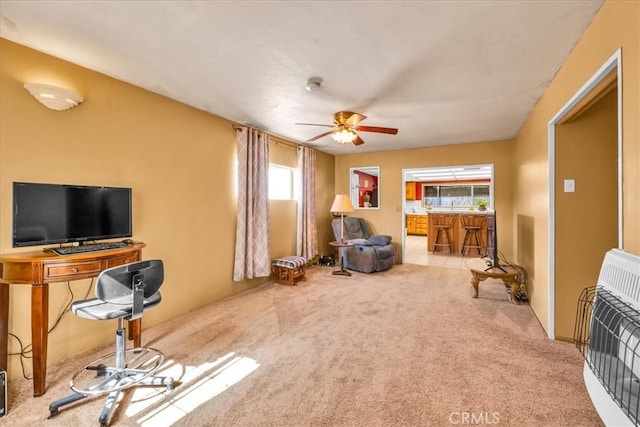 1638 Hales Dr Unit 29, Palms, CA 92277 - carpeted living area with heating unit and a ceiling fan