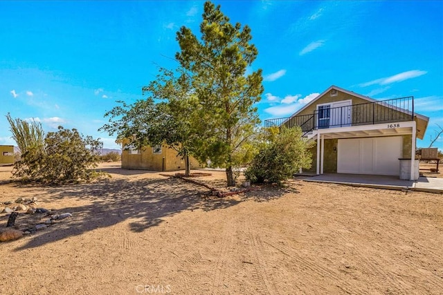 1638 Hales Dr Unit 29, Palms, CA 92277 - view of front of house with a balcony and an attached garage