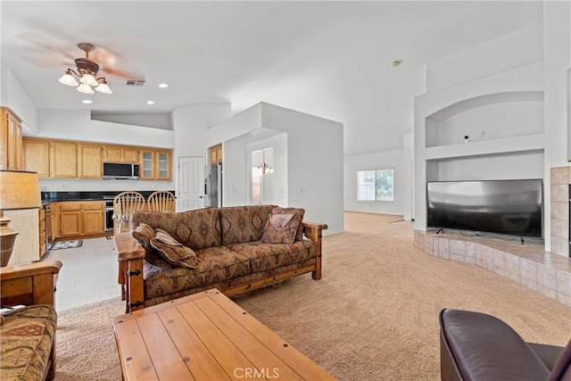 2041 Kalliope Ave, Lancaster, CA 93536 - living room with light colored carpet, built in shelves, a ceiling fan, recessed lighting, and a high ceiling