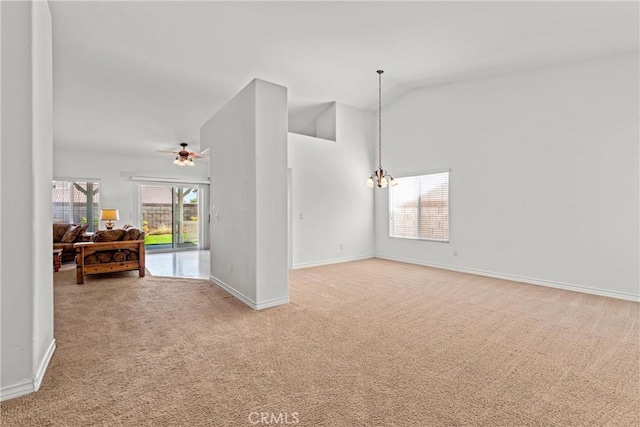 2041 Kalliope Ave, Lancaster, CA 93536 - empty room featuring light carpet, lofted ceiling, ceiling fan, and a chandelier
