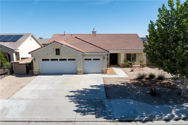 2041 Kalliope Ave, Lancaster, CA 93536 - view of front of house with stucco siding, a tiled roof, an attached garage, driveway, and a chimney
