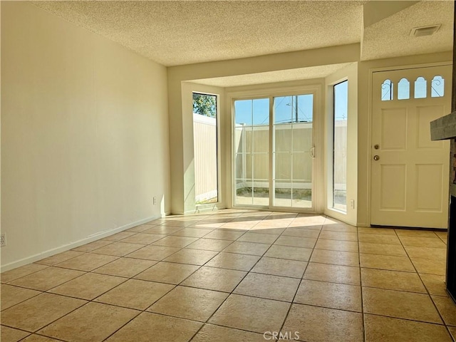 16115 Central Ave, La Puente, CA 91744 - entryway featuring a textured ceiling and light tile patterned floors