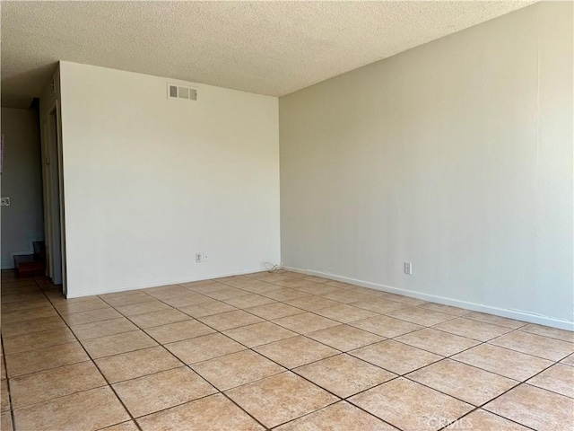 16115 Central Ave, La Puente, CA 91744 - unfurnished room with a textured ceiling and light tile patterned floors