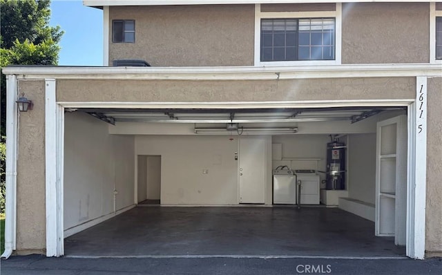 16115 Central Ave, La Puente, CA 91744 - garage with washing machine and dryer and secured water heater