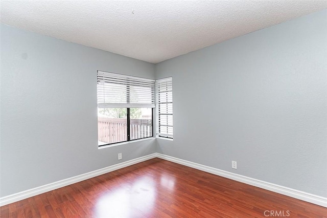 13100 Creek View Dr Unit 204, Garden Grove, CA 92844 - spare room with wood finished floors and a textured ceiling