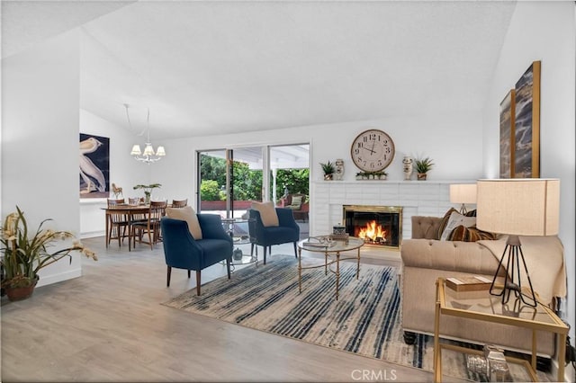 9545 Rubio Ave, Northridge, CA 91343 - living area with vaulted ceiling, a chandelier, a fireplace, and wood finished floors