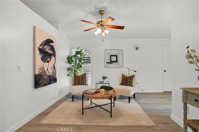 9545 Rubio Ave, Northridge, CA 91343 - living area featuring ceiling fan, wood finished floors, and vaulted ceiling