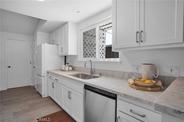 9545 Rubio Ave, Northridge, CA 91343 - kitchen with dishwasher, white cabinetry, light wood-type flooring, and freestanding refrigerator