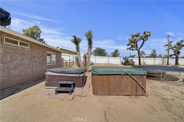 58706 Buena Vista Dr, Yucca Valley, CA 92284 - fenced backyard with a hot tub and a patio area