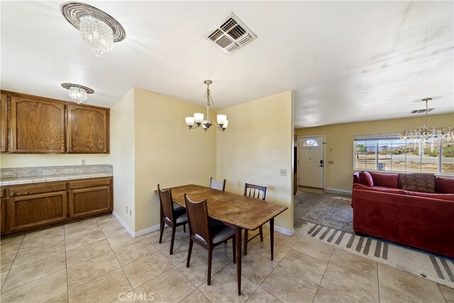 58706 Buena Vista Dr, Yucca Valley, CA 92284 - dining area with a chandelier and light tile patterned floors