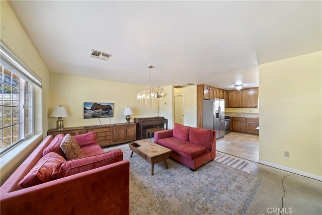 58706 Buena Vista Dr, Yucca Valley, CA 92284 - living room with concrete flooring and a chandelier