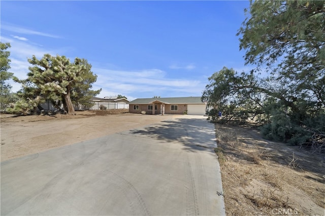 58706 Buena Vista Dr, Yucca Valley, CA 92284 - view of front of home featuring driveway and an attached garage