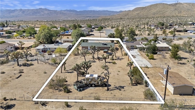 58706 Buena Vista Dr, Yucca Valley, CA 92284 - aerial view of residential area featuring a mountain backdrop and property boundaries highlighted