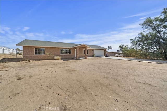 58706 Buena Vista Dr, Yucca Valley, CA 92284 - view of front facade with concrete driveway and an attached garage
