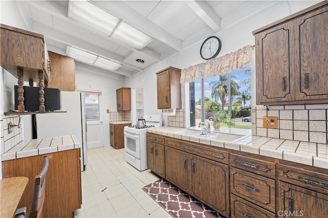 16140 Bycroft St, Hacienda Heights, CA 91745 - kitchen featuring white appliances, tasteful backsplash, healthy amount of natural light, beamed ceiling, and tile countertops