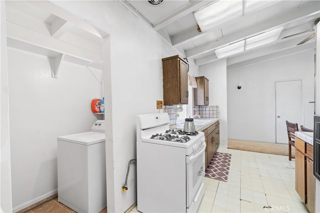 16140 Bycroft St, Hacienda Heights, CA 91745 - kitchen featuring white gas stove, washer / dryer, beam ceiling, and light countertops