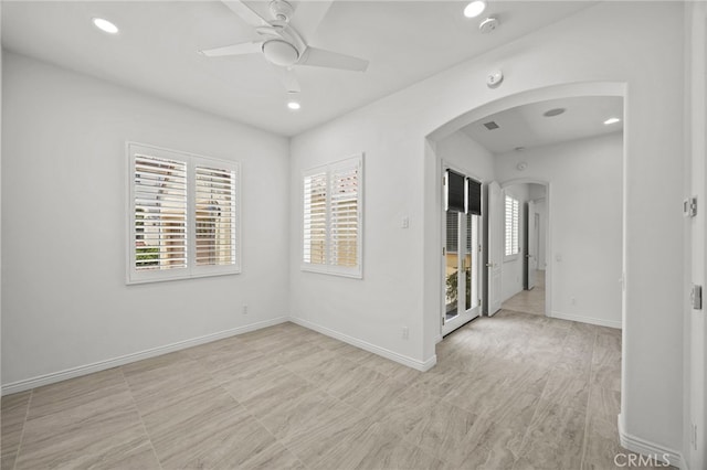 9116 Pinyon Point Ct, Corona, CA 92883 - empty room featuring arched walkways, a ceiling fan, recessed lighting, and a smoke detector