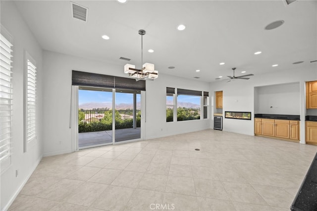9116 Pinyon Point Ct, Corona, CA 92883 - unfurnished living room with recessed lighting, a chandelier, ceiling fan, light tile patterned flooring, and wine cooler