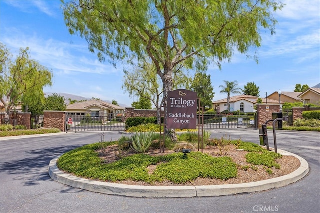 9116 Pinyon Point Ct, Corona, CA 92883 - community / neighborhood sign with a gate and a residential view