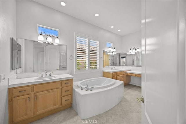 9116 Pinyon Point Ct, Corona, CA 92883 - bathroom with two vanities, tile patterned floors, a bath, and recessed lighting