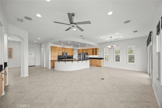 9116 Pinyon Point Ct, Corona, CA 92883 - unfurnished living room with arched walkways, recessed lighting, and a ceiling fan