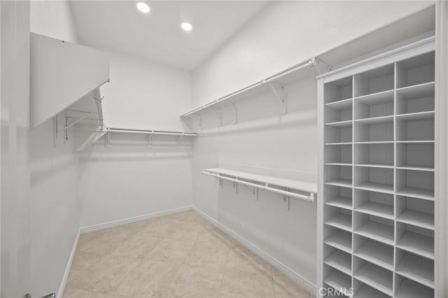 9116 Pinyon Point Ct, Corona, CA 92883 - spacious closet featuring light tile patterned floors